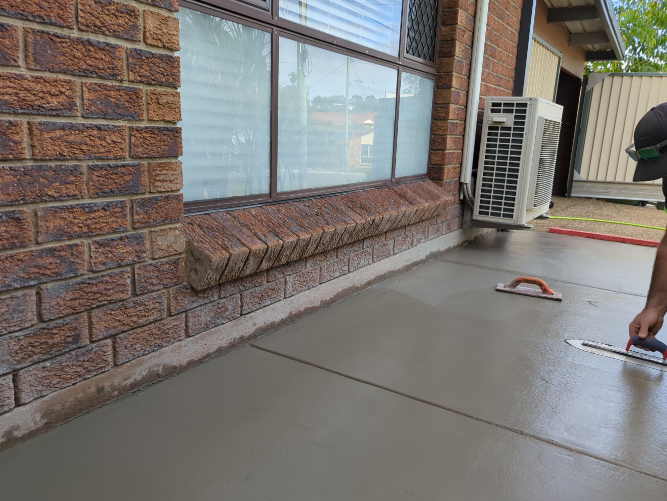 Hand finishing concrete from the garden bed